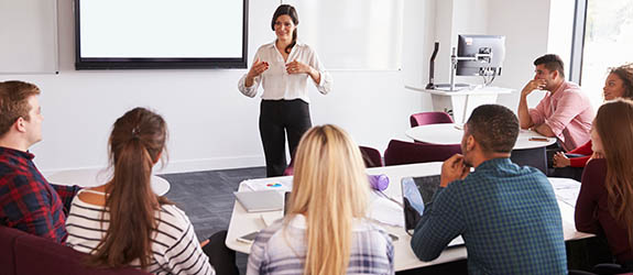 Image of a science teacher teaching a class