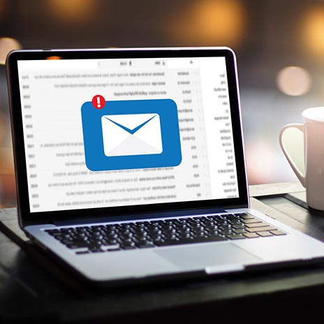 Computer with email icon on screen