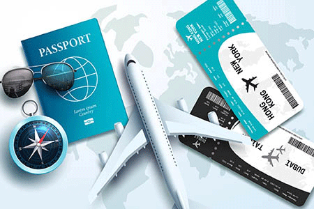 sunglasses, a compass, a model plane, a passport and plane tickets lay on a map