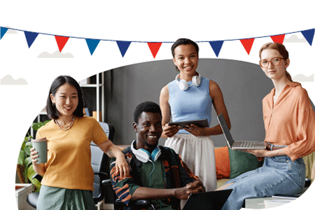 a group of four diverse, smiling students, one seated and three standing, with a garland of red and blue triangles hanging above them
