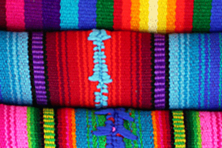 a close-up of brightly colored woven fabrics