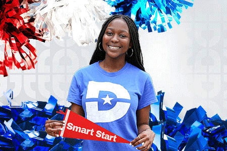 student wearing a D logo T-shirt holding a "Smart Start" pennant