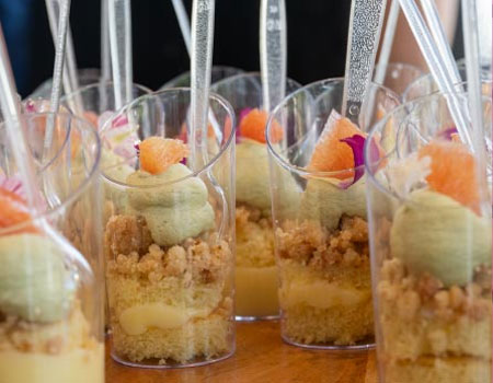 Cups of dessert sit on a table at the Bits and Bites event