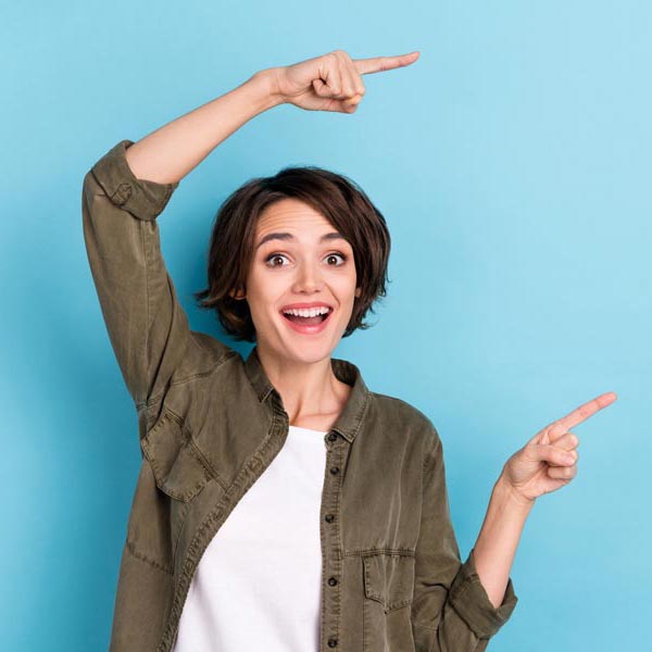 Girl pointing and smiling