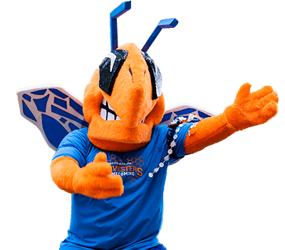The Eastfield Bee mascot pumps his fists