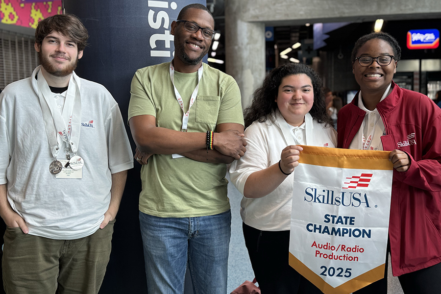 Skills USA Students pose with banner