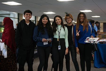 A group of job fair students smiling at the camera