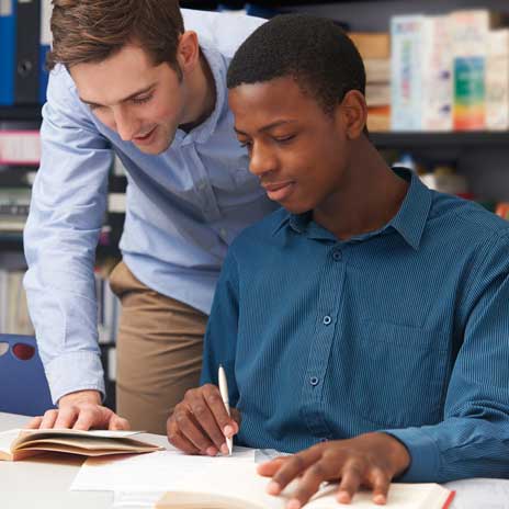 Student receiving academic guidance in a library setting
