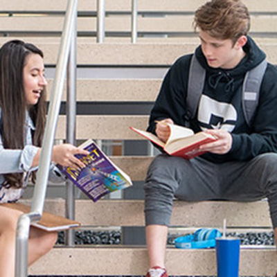 Students study on the stairwell at Richland Sabine Hall