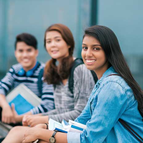 Photo of three students smiling