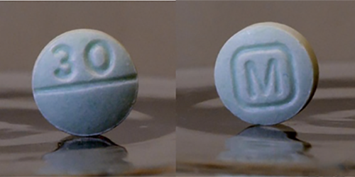 Two blue pills are fake oxycodone