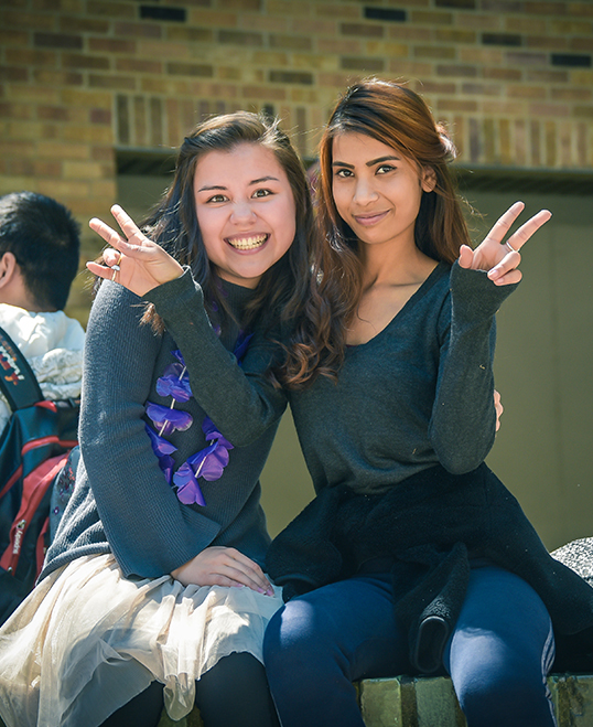 Two female students smiling