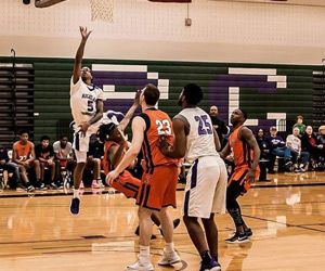 A Richland basketball player makes a jump shot during a game