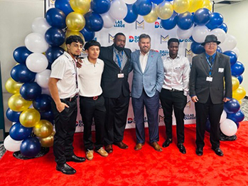 Students at the MAP Summit pose with Chancellor Lonon under a balloon arch
